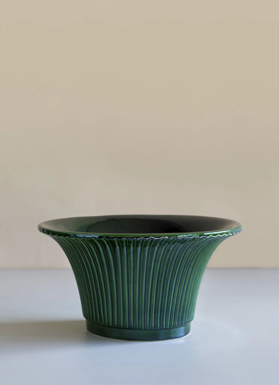 Bergs Potter Daisy cachepot with ribbed sides and an emerald-green glaze.